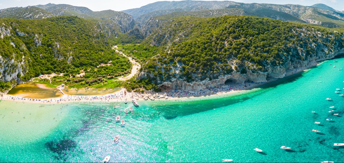 Drone view of the vibrant Cala Luna Beach on Sardinia island, Italy © Adobe Stock