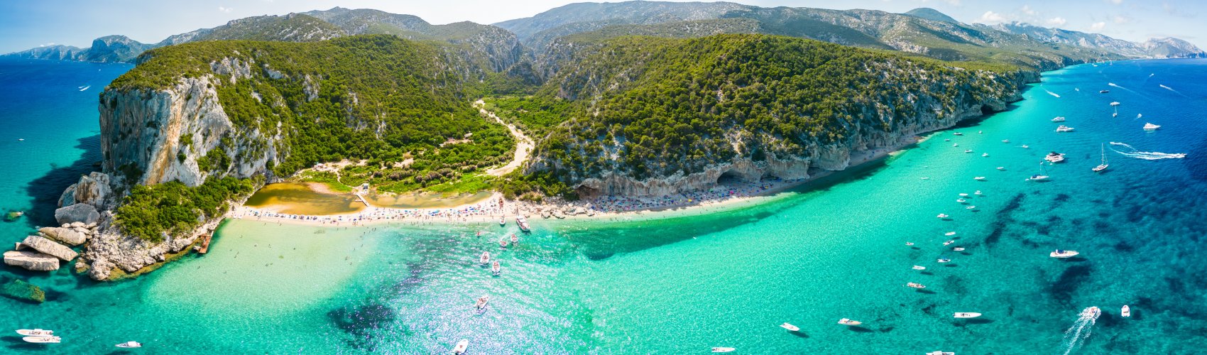 Drone view of the vibrant Cala Luna Beach on Sardinia island, Italy © Adobe Stock